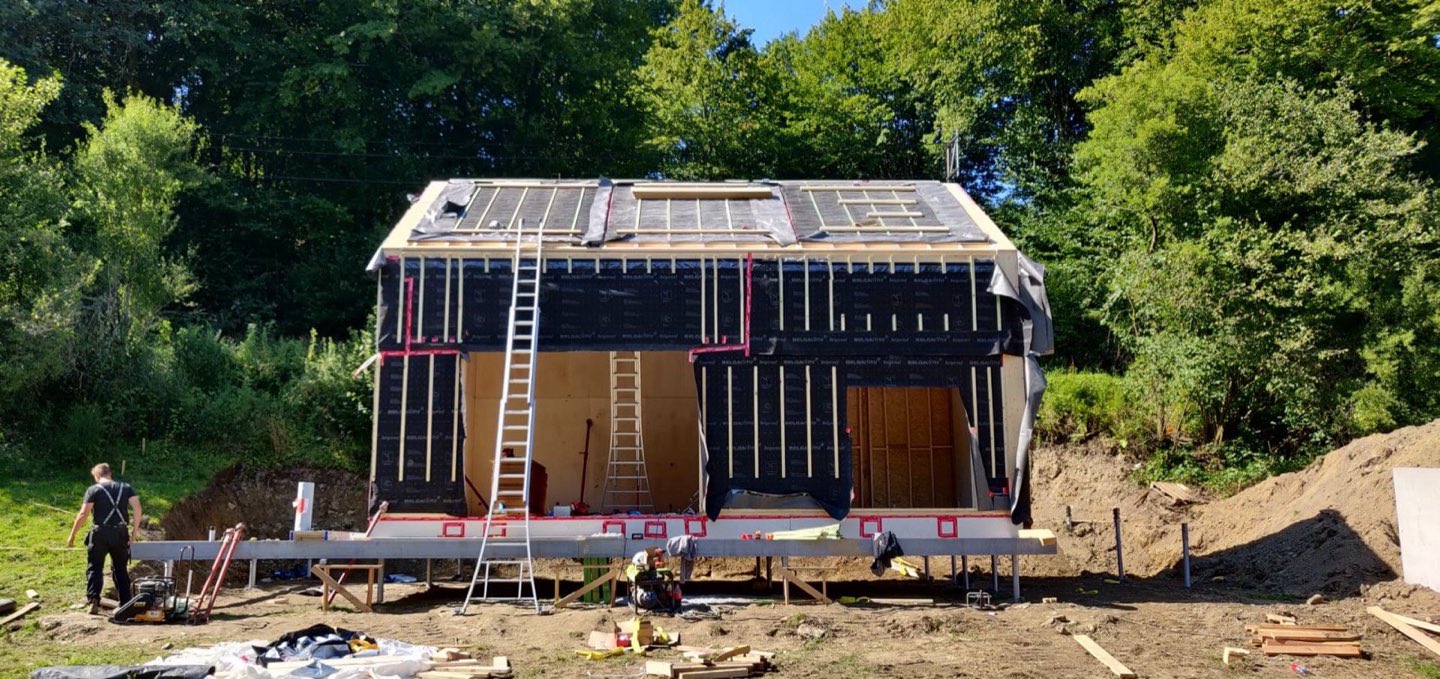Timber-frame home under construction on a steel frame on screw piles in Bouillon
